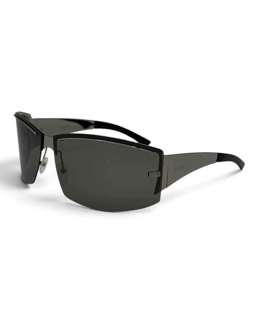 LUXVINTAGELISBON Gucci shield frame sunglasses in dark grey metal with wrap-around design and logo detail on temples.