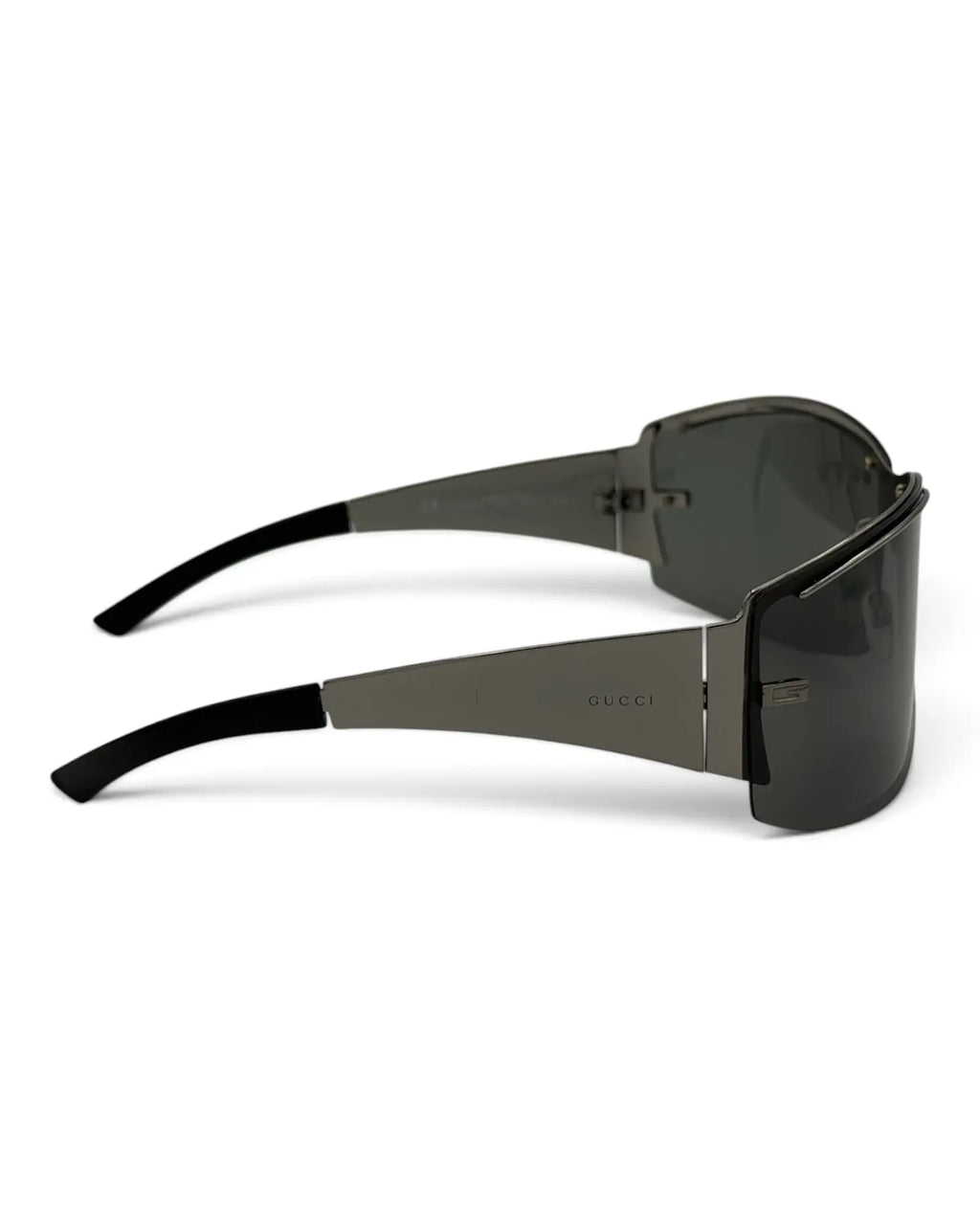 LUXVINTAGELISBON Gucci shield frame sunglasses in dark grey metal with wrap-around lenses and logo on the temples.