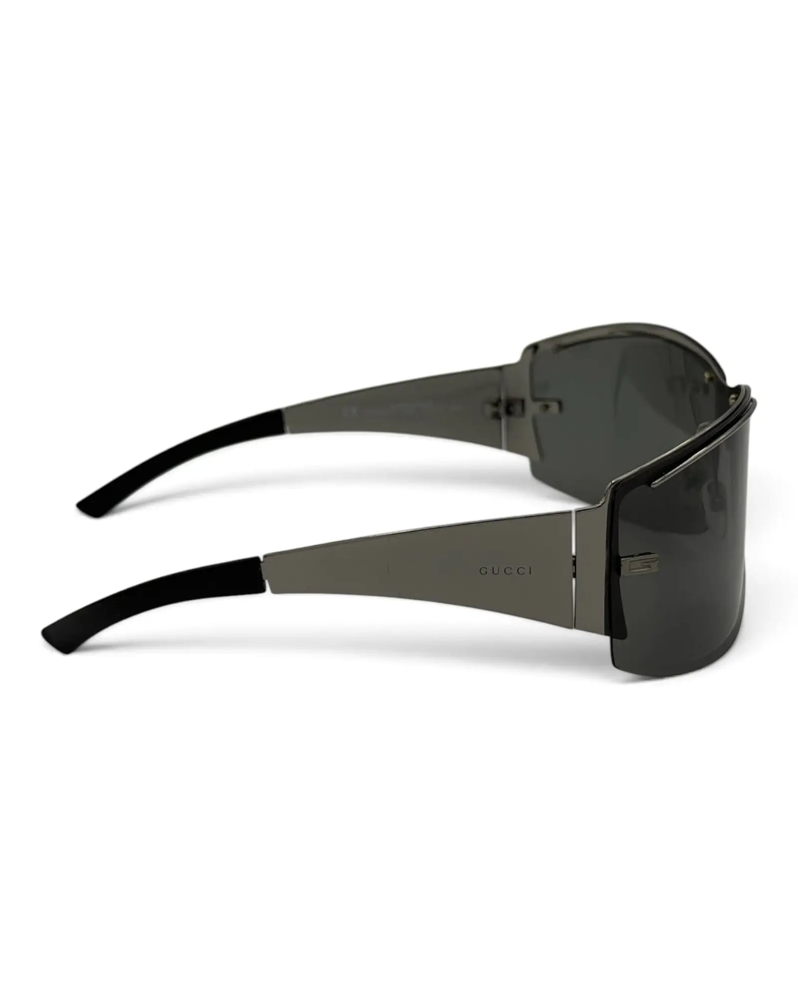 LUXVINTAGELISBON Gucci shield frame sunglasses in dark grey metal with wrap-around lenses and logo on the temples.