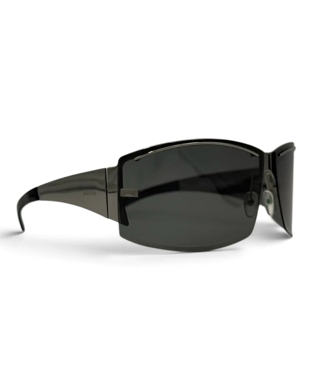 LUXVINTAGELISBON Gucci shield frame sunglasses in dark grey metal with dark lenses and a futuristic wrap-around design.